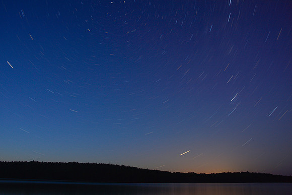 Stars circle the North Star above David Lake