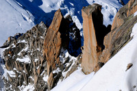 Looking down on rock towers from the Aiguille du Midi