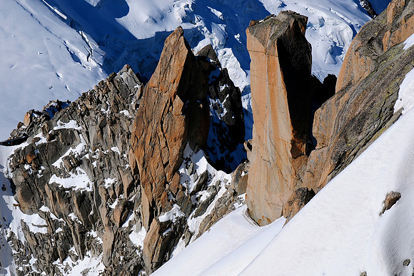 Looking down on rock towers from the Aiguille du Midi