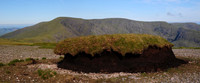 A peat hag on Meenteog's west ridge, with Coomacarrea and Teermoyle Mountain in the background, County Kerry