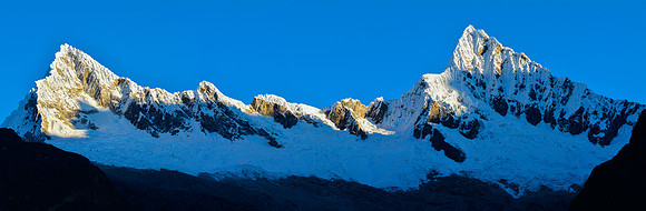 Sunrise on the ridge between Quitaraju and Alpamayo, from Taullipampa