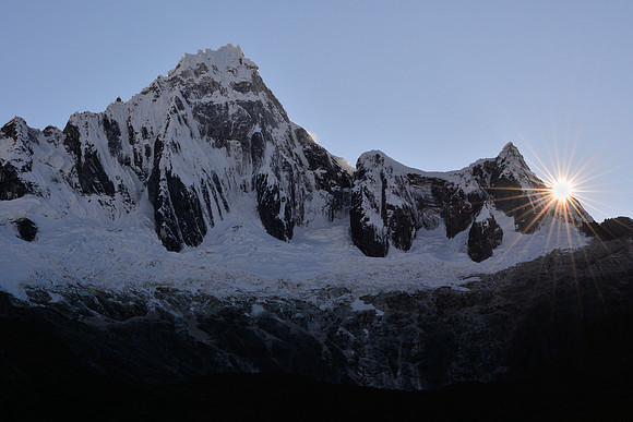 Sunrise behind Taulliraju, from Taullipampa