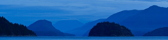 Looking north from Feather Cove before sunrise. The dome-shaped island is Station Island, Kinghorn Island is in the foreground to its left and West Redonda Island is behind it.