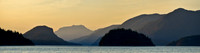 Looking north from Feather Cove before sunrise. The dome-shaped island is Station Island, Kinghorn Island is in the foreground to its left and West Redonda Island is behind it.