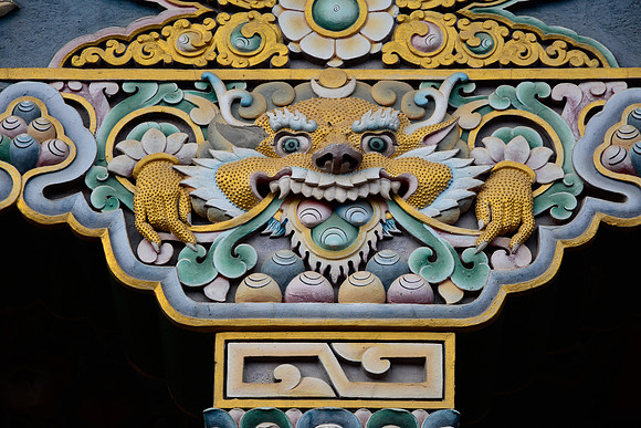 Woodcaarving of Zeepata above the entrance to Guru Lhakhang Monastery, Boudhanath, Kathmandu
