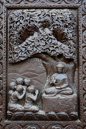 Woodcarving of Buddha on a door, Boudhanath, Kathmandu