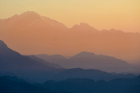 A hazy sunrise above Pokhara from the ridge south of Phewa Lake