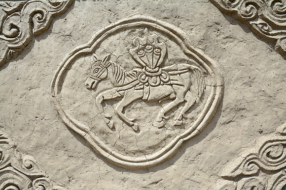 Bas-relief carving on a stupa at Karang Gompa