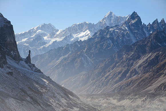 A rock spire at the base of Gimmigela, with Sarphu in the distance