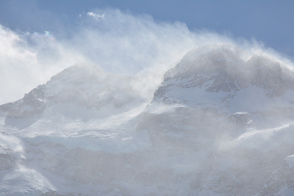 HIgh winds scour the summit of Kanchenjunga (on the left)