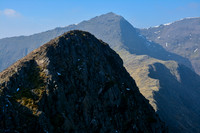Y Lliwedd's main summit from its east peak, with Snowdon in the distance