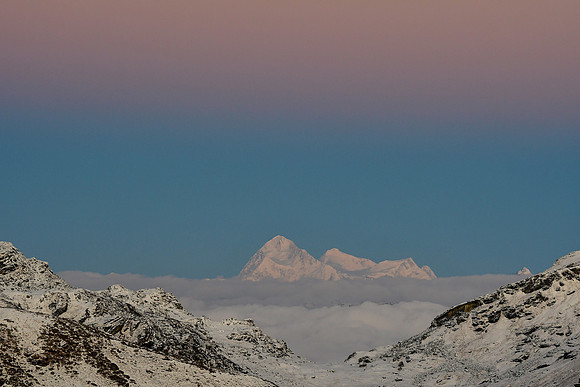 Makalu, Mount Everest and Chomolonzo at sunrise from the ridge northeast of Danphebir Pass