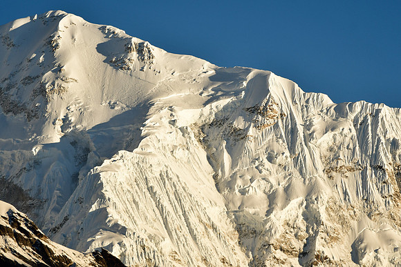 Early morning light on Zemu Peak on Kangchenjunga's southeast ridge, viewed from Tangshing