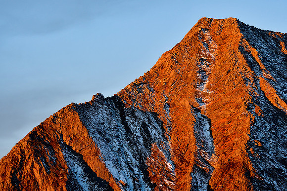 Sunrise on the peak northwest of Kokling Pass from the ridge northeast of Panding