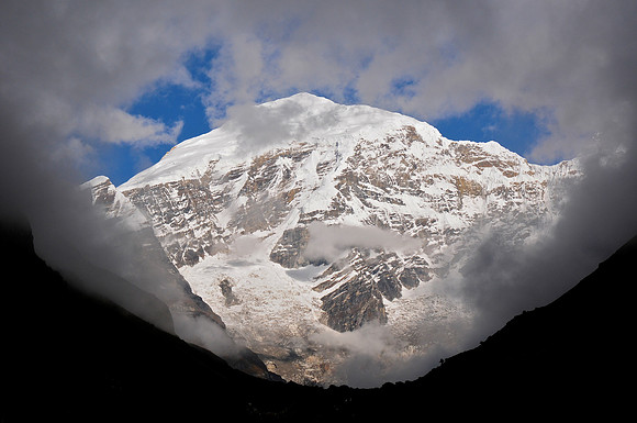 The clouds part to reveal Jomolhari from Jomolhari Camp