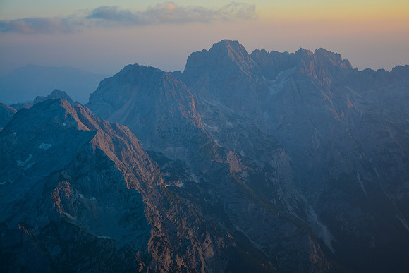 Sunrise view towards Skrlatica from Triglav's summit